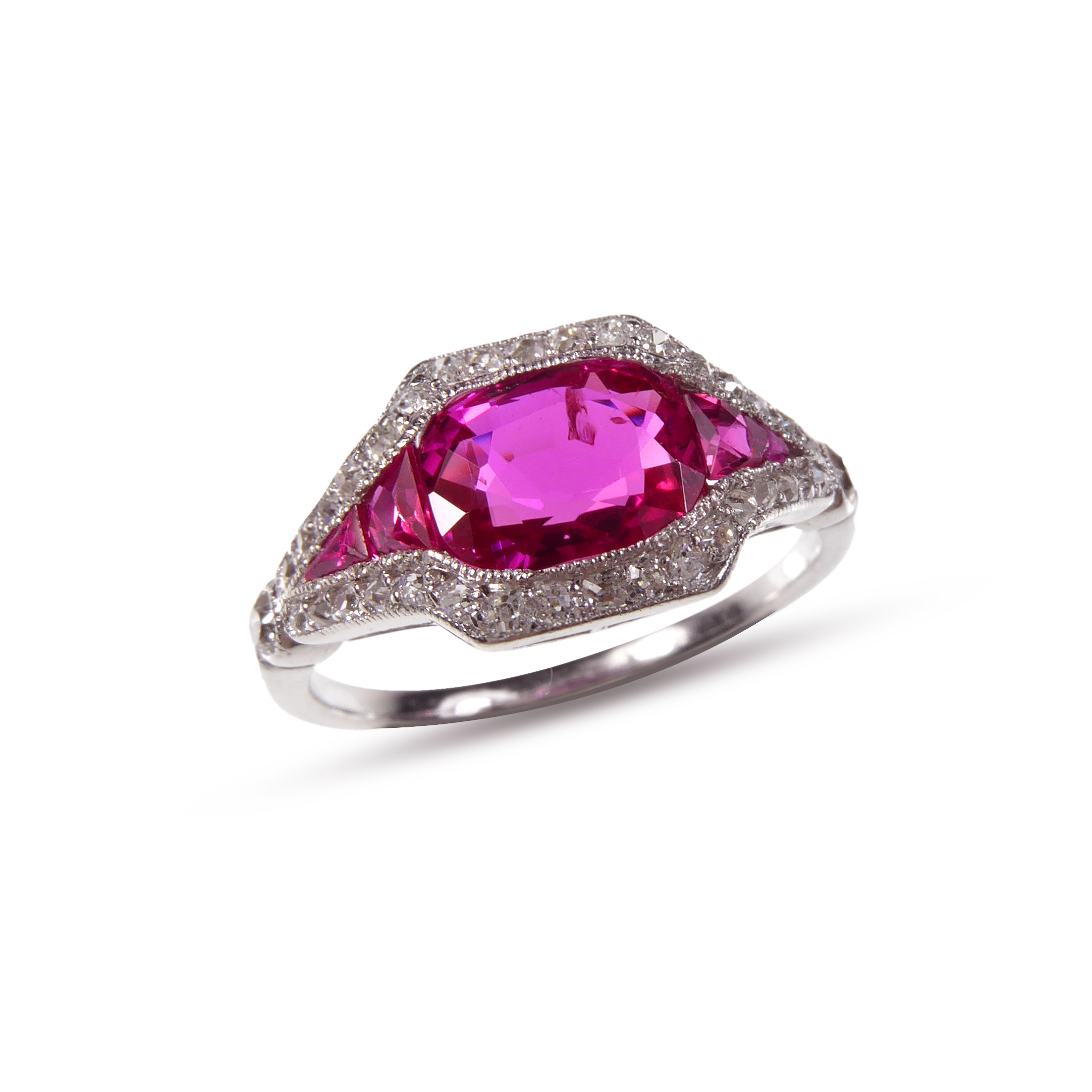 Early 20th century ruby and diamond 'eye' cluster ring, French c.1910, central cushion cut Burma ruby of approximately 1.30ct,